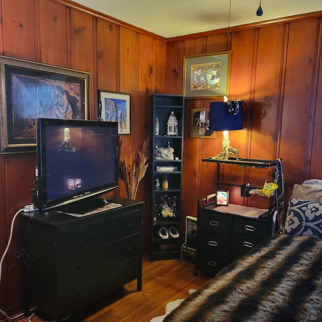 living room with dark hardwood / wood-style floors and wooden walls