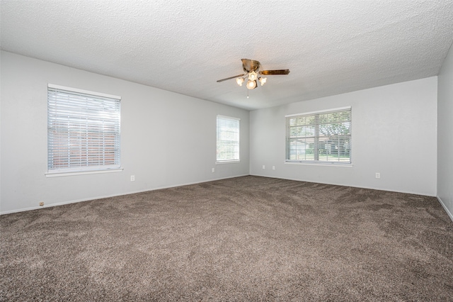 spare room with carpet floors, a textured ceiling, and ceiling fan