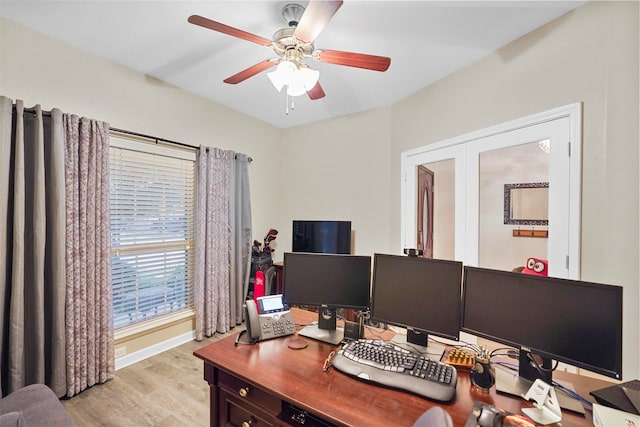 office space with french doors, light wood-type flooring, and ceiling fan