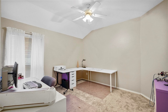 home office featuring lofted ceiling, light carpet, and ceiling fan