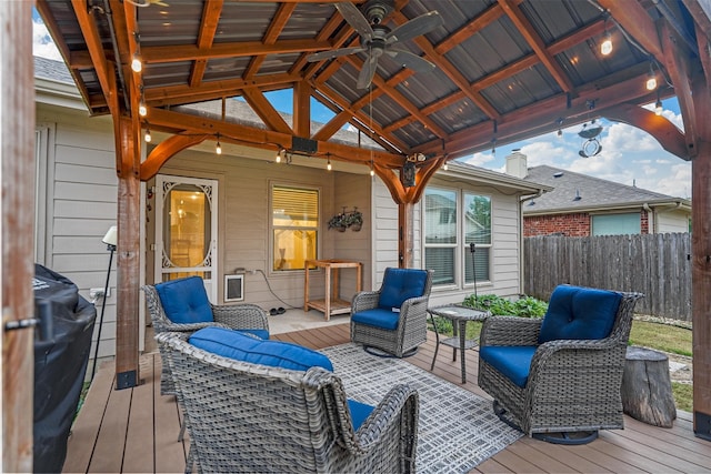 wooden deck featuring a gazebo and ceiling fan