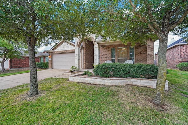 view of front of house with a front lawn and a garage