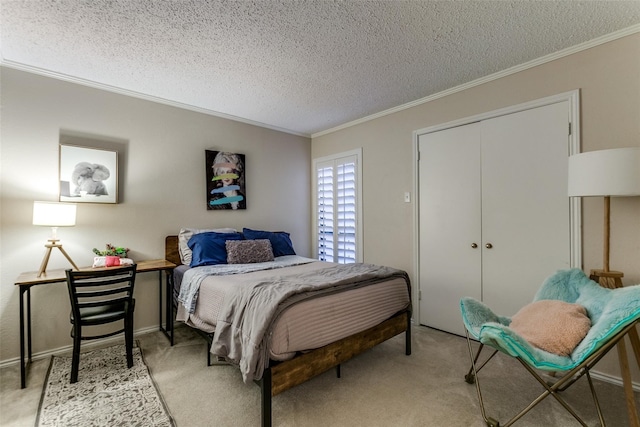 carpeted bedroom featuring a textured ceiling, a closet, and crown molding