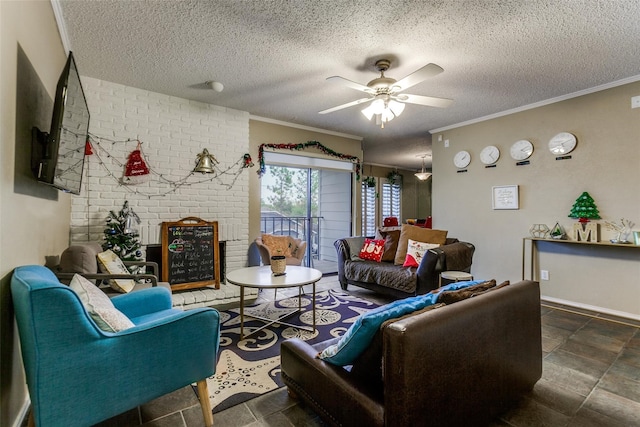 living room featuring ceiling fan, a textured ceiling, a fireplace, and ornamental molding