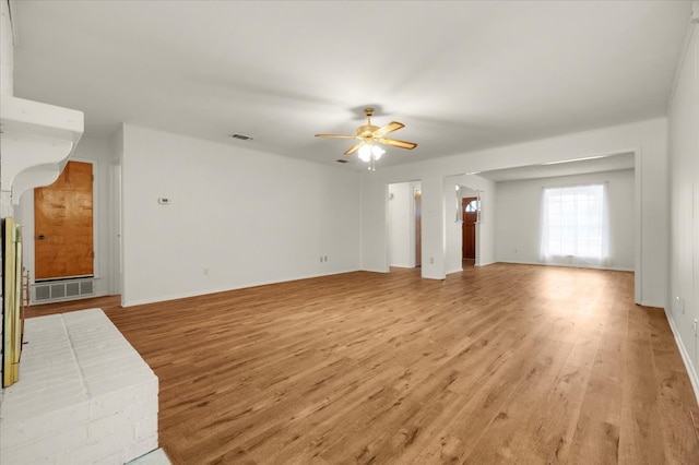 unfurnished living room with light hardwood / wood-style flooring and ceiling fan