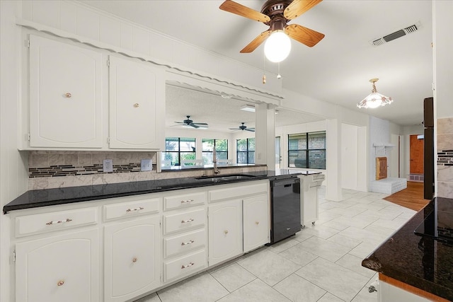 kitchen with white cabinets, light tile patterned flooring, sink, dishwasher, and decorative backsplash