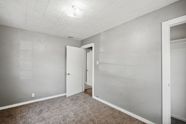 unfurnished bedroom with carpet