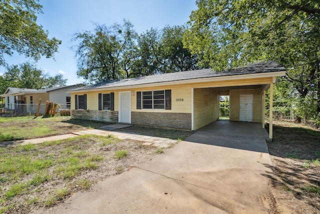 ranch-style home with a carport