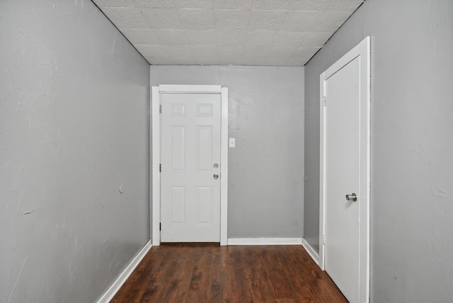 hall with dark hardwood / wood-style floors