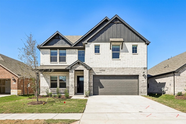 view of front of home with a garage and a front lawn