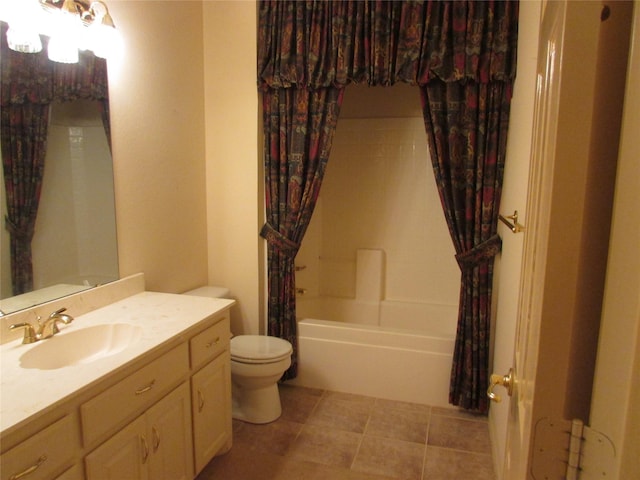 full bathroom featuring vanity, toilet, shower / bath combo with shower curtain, and tile patterned flooring