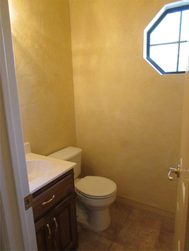 bathroom with toilet and vanity