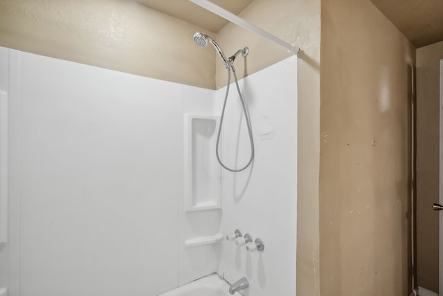 room details featuring shower / bathing tub combination