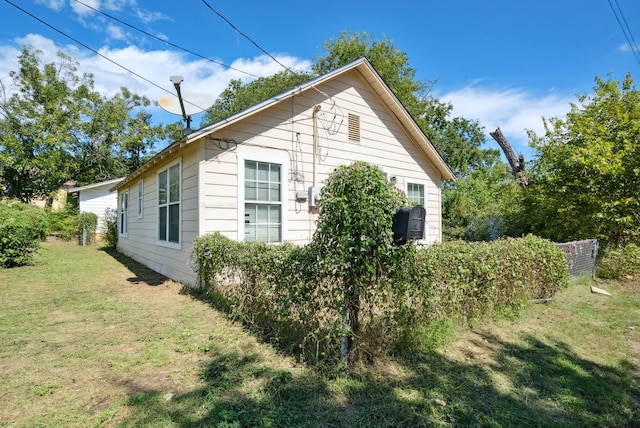 view of home's exterior featuring a yard