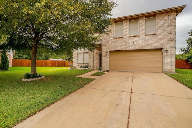 view of front facade featuring a front yard and a garage