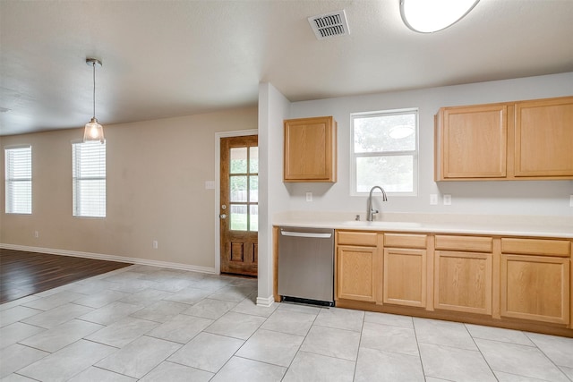 kitchen featuring pendant lighting, light brown cabinets, sink, dishwasher, and light hardwood / wood-style floors