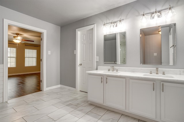 bathroom featuring vanity, ceiling fan, and hardwood / wood-style floors