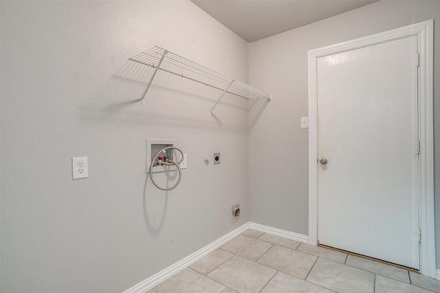 laundry room with electric dryer hookup, hookup for a washing machine, and light tile patterned flooring