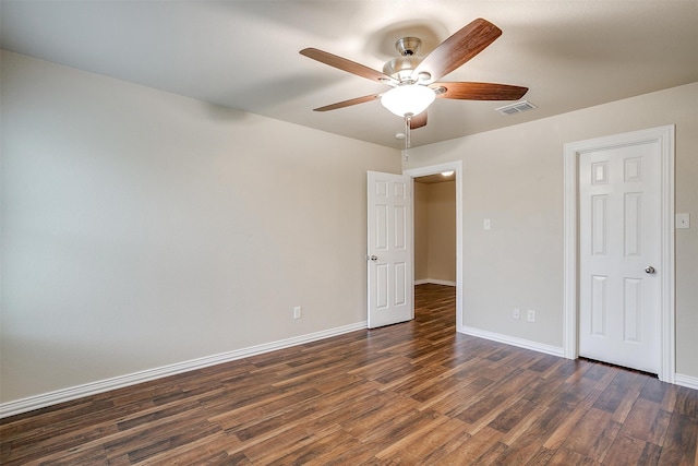 unfurnished bedroom featuring dark hardwood / wood-style flooring and ceiling fan