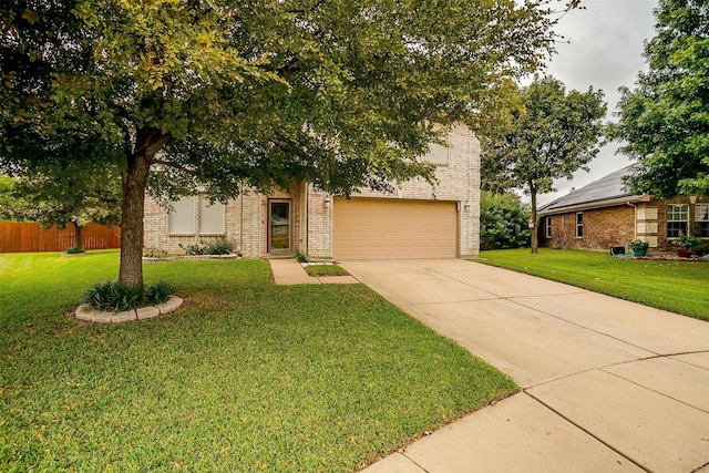 view of front of property featuring a front lawn and a garage