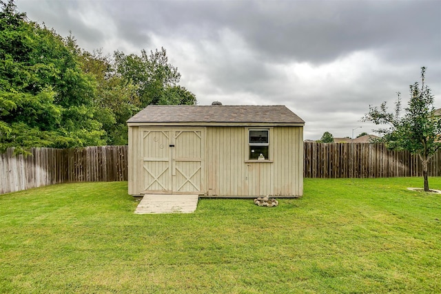 view of outbuilding featuring a lawn