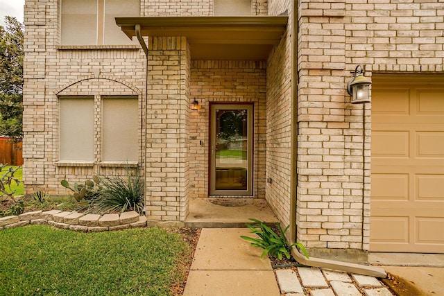 doorway to property featuring a garage