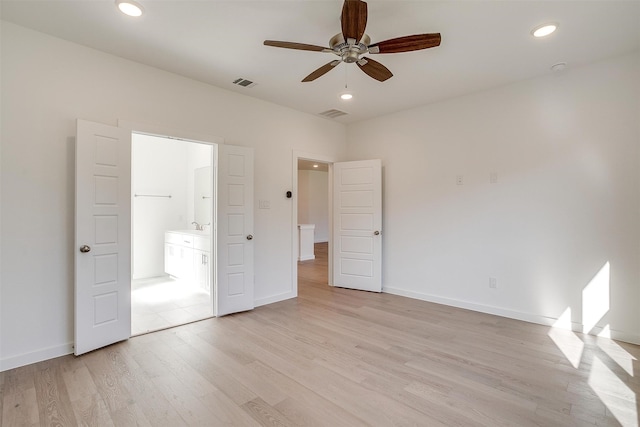 unfurnished bedroom with light hardwood / wood-style flooring, sink, and ceiling fan