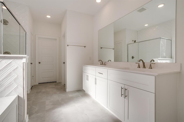 bathroom featuring vanity, tile patterned floors, and an enclosed shower