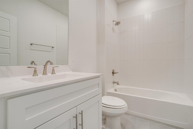 full bathroom featuring vanity, toilet, tile patterned flooring, and tiled shower / bath