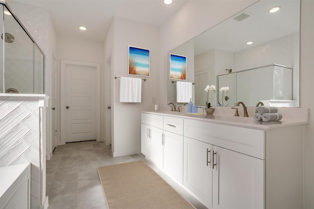 bathroom featuring vanity, tile patterned flooring, and an enclosed shower