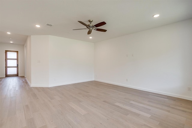 unfurnished room featuring ceiling fan and light wood-type flooring