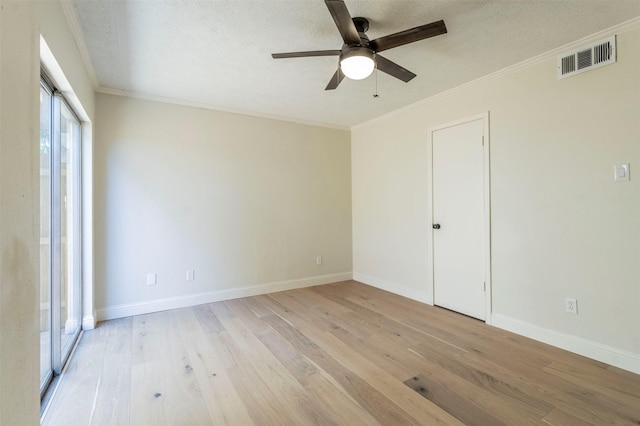 unfurnished room with light wood-style floors, visible vents, a ceiling fan, and baseboards