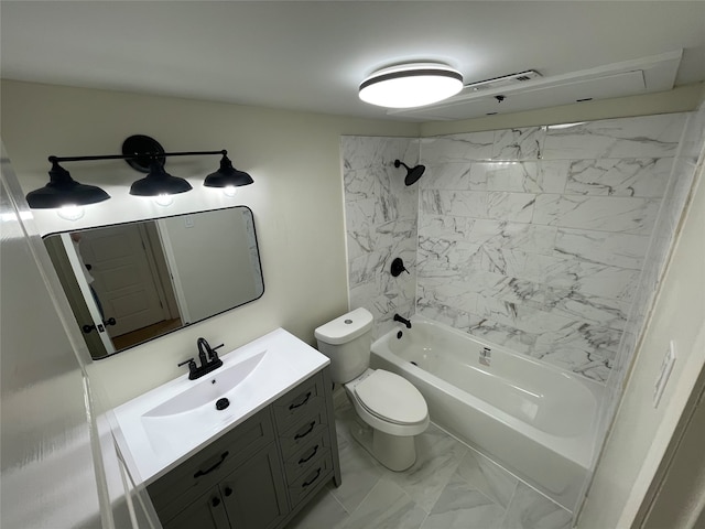 full bathroom with tiled shower / bath, vanity, and toilet