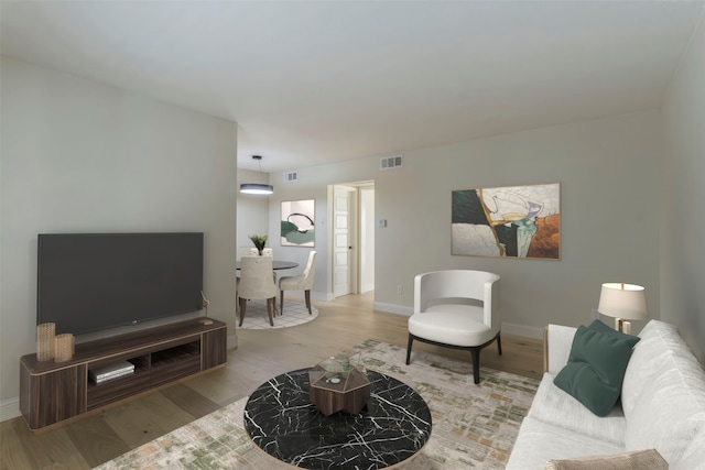 living room with light hardwood / wood-style floors