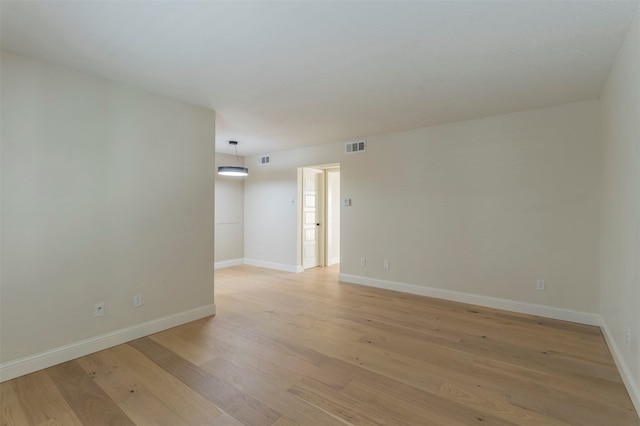 spare room with light hardwood / wood-style flooring