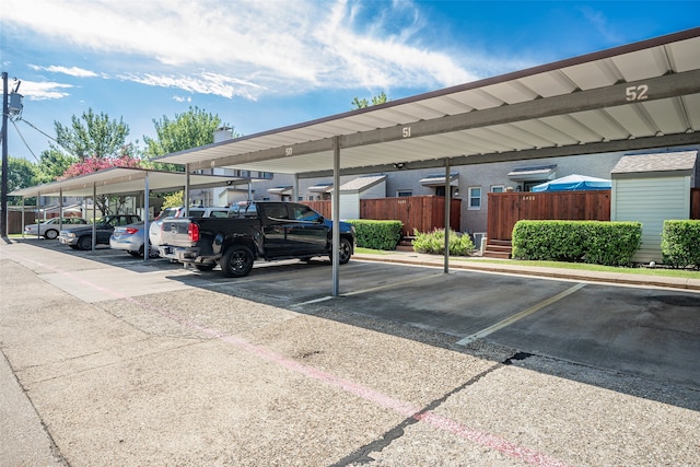 view of parking / parking lot with a carport