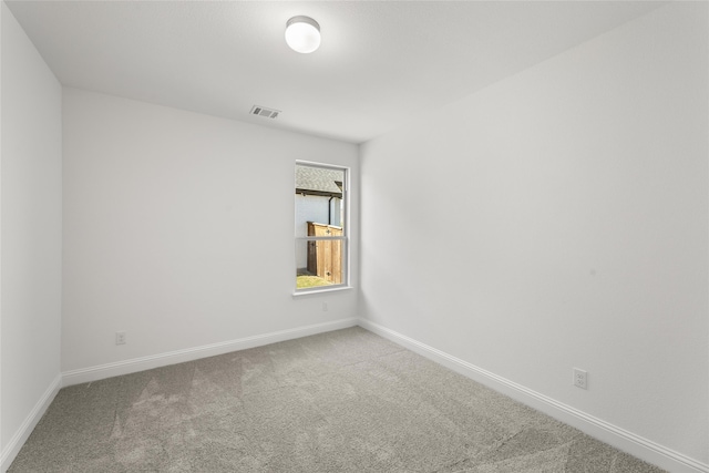 unfurnished room featuring carpet floors