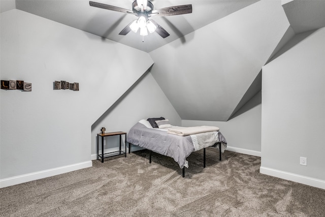 carpeted bedroom featuring ceiling fan and vaulted ceiling