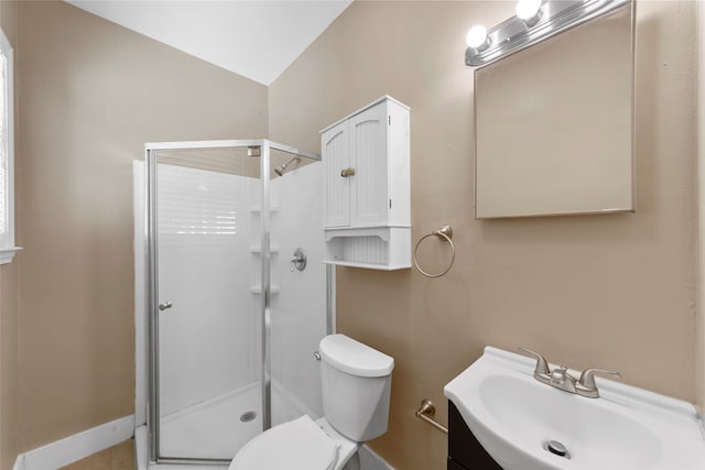 bathroom with vanity, toilet, walk in shower, and lofted ceiling