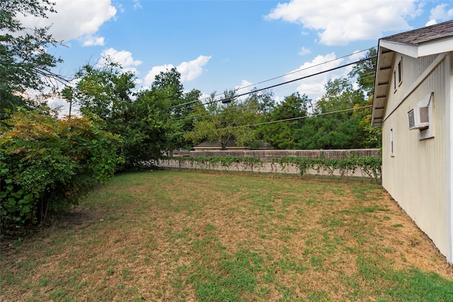 view of yard with a wall mounted AC