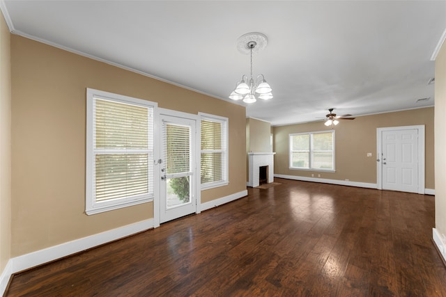 unfurnished living room featuring ornamental molding, a fireplace, dark hardwood / wood-style floors, and ceiling fan with notable chandelier