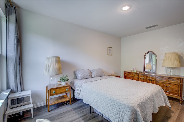 bedroom featuring hardwood / wood-style floors