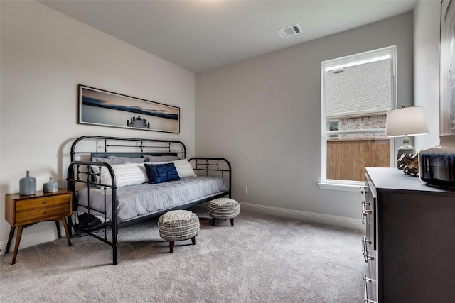 bedroom featuring light colored carpet