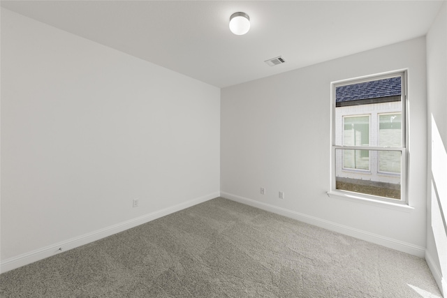 empty room with carpet flooring