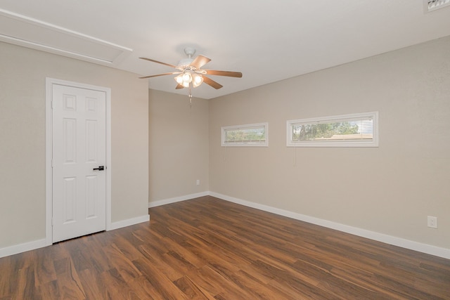 unfurnished room featuring ceiling fan and dark hardwood / wood-style flooring