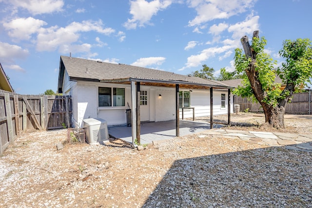 back of property with a patio area