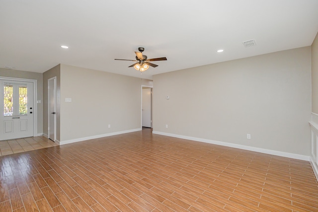 unfurnished living room featuring ceiling fan