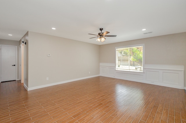 empty room featuring ceiling fan and light wood-type flooring