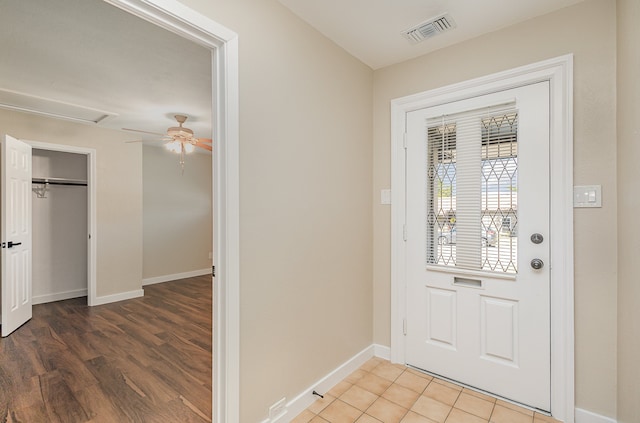 doorway to outside with hardwood / wood-style flooring and ceiling fan