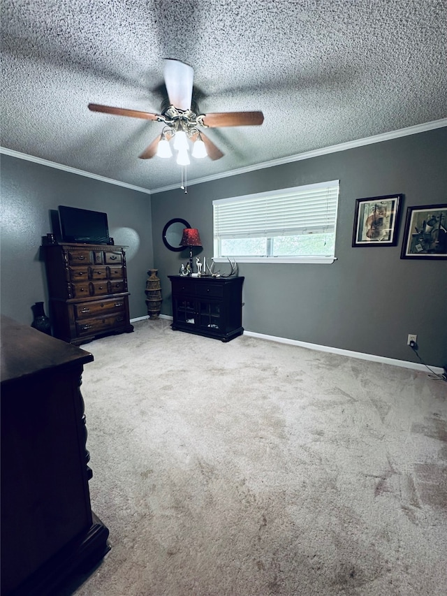 carpeted bedroom with a textured ceiling, crown molding, and ceiling fan